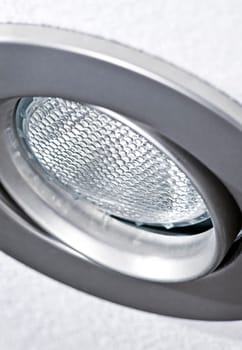 Closeup of pot light recessed lighting in ceiling tile
