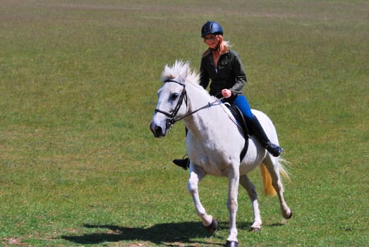 Pretty girl on white horse