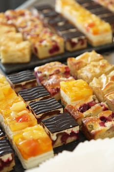 Cake buffet with various delicious cakes - portrait format - close-up
