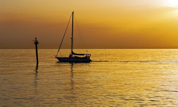 Sailboat at dawn, taken from Barcelona on the Mediterranean sea.