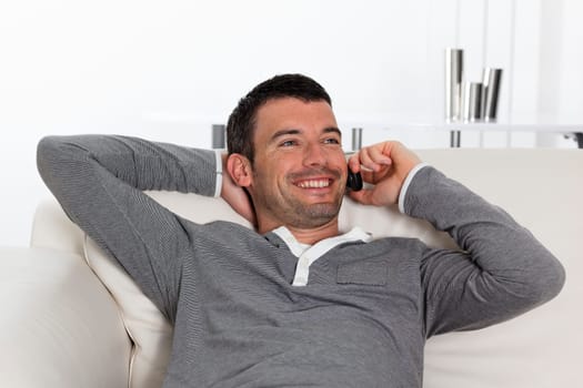 young man on the phone on sofa