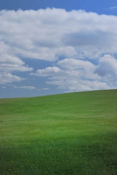 Cloudy blue sky and green fields sussex