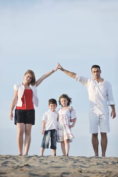 happy young family have fun and live healthy lifestyle on beach