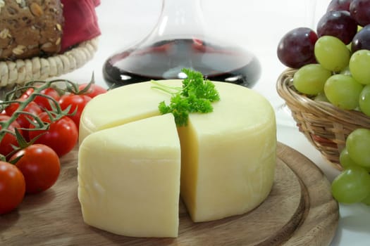a loaf of goat cheese on a wooden board