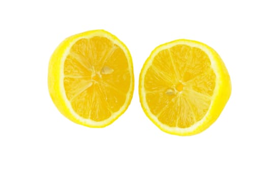 Two fresh, bright yellow citrus fruit pieces on white.