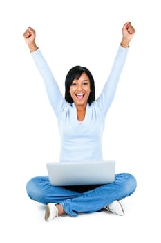 Happy black woman with arms raised and computer isolated on white background
