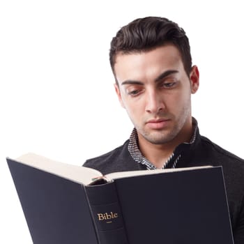 Portrait of a young man reading the Bible