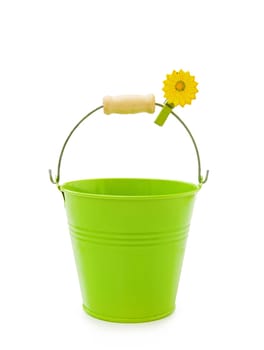 Love gardening - pretty green bucket with flower clip isolated on white.