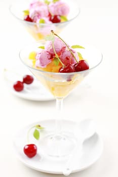Pineapple punch  with cherry ice cream and mint