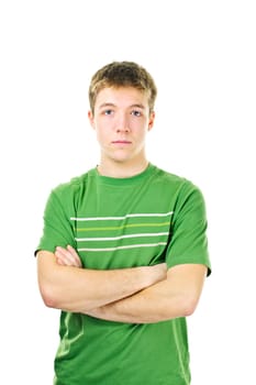 Serious young man standing with arms crossed isolated on white background