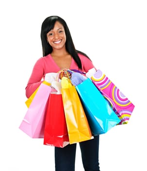 Young smiling black woman holding colorful shopping bags
