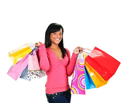 Young smiling black woman holding colorful shopping bags