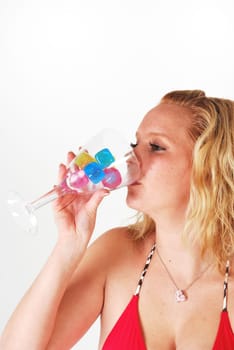 pretty girl in red enjoying a drink