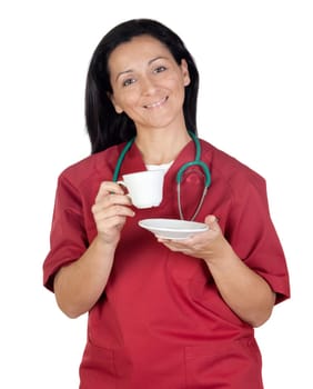 Happy doctor woman having a cup of coffee isolated on white background