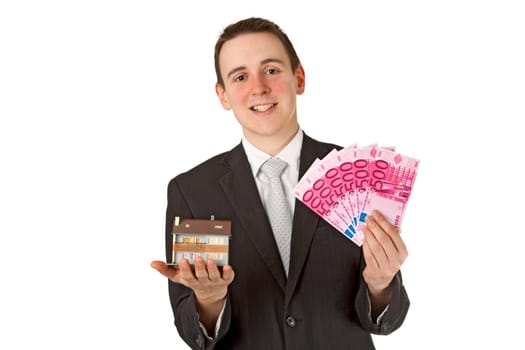 Friendly businessman presenting model house - isolated on white background