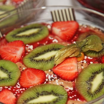delicious dessert with strawberries and kiwi - close-up