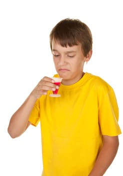 teenage boy drinking disgusing cherry medicine