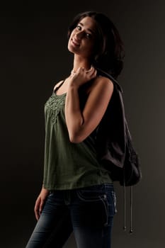 beuatiful young fashion teenager on dark gray