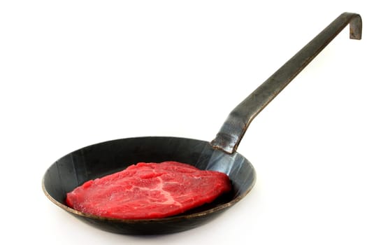 a beef steak in a pan