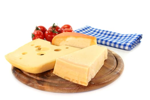 different types of cheese on a wooden board
