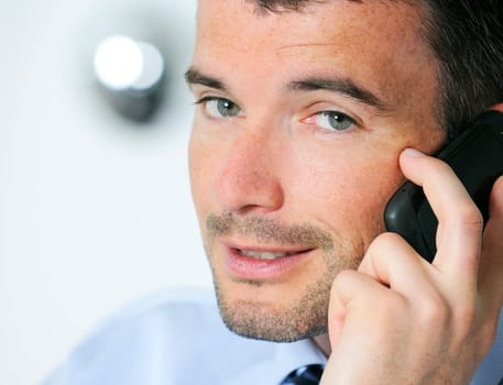 businessman is having a communication with his cellphone