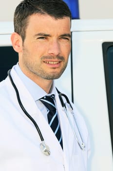 portrait of doctor in front of an ambulance
