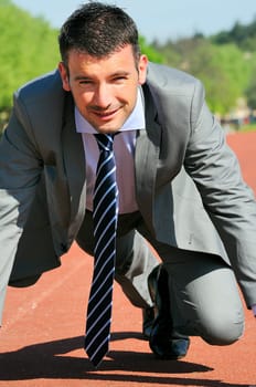 Portrait of a businessman on the starting blocks