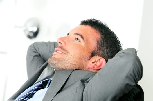 Attractive businessman is taking break from business