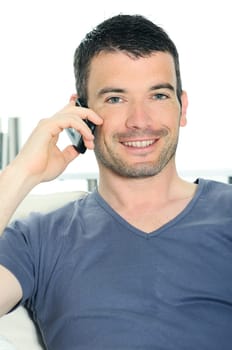 relaxed man with having a communication with a cellephone