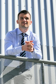 great and serious businessman is having a moment outtdoor