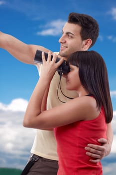 Portrait of happy young couple looking for beauties of nature
