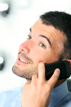 businessman is having a communication with his cellphone