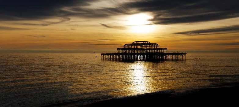 Panoramic view of the West Pier in Brighton at sunset