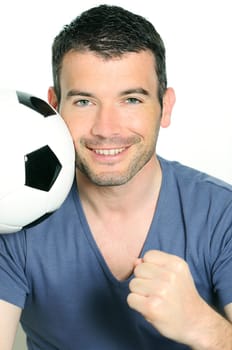 closeup of passionate soccer player with white and black balloon