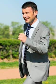Portrait of a businessman outdoor with winner spirit