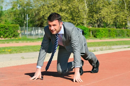 Portrait of a businessman on the starting blocks