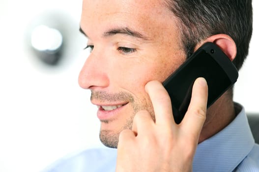 businessman is having a communication with his cellphone