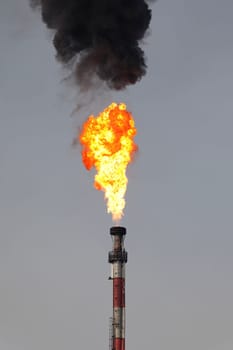 fire of refinery industry with black smoke