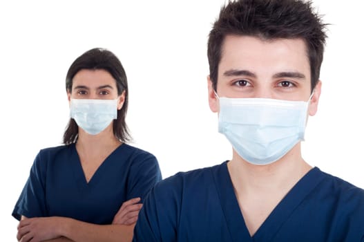 portrait of a team of doctors, man and woman wearing mask and uniform isolated on white background