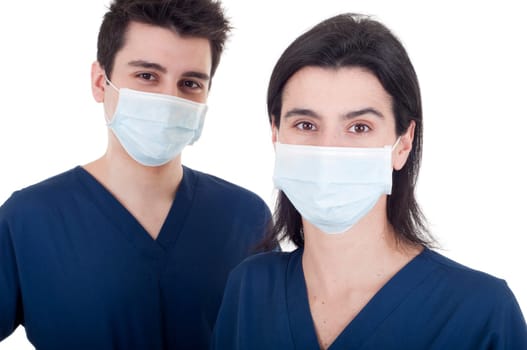 portrait of a team of doctors, man and woman wearing mask and uniform isolated on white background