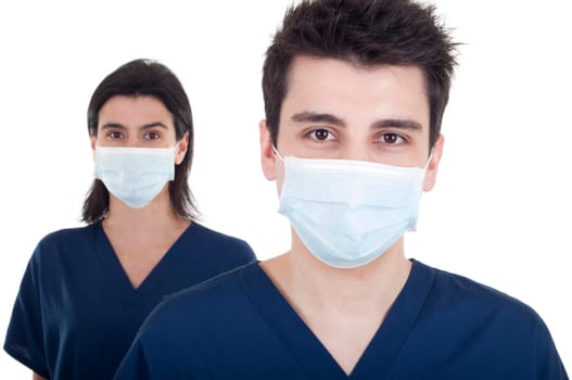portrait of a team of doctors, man and woman wearing mask and uniform isolated on white background