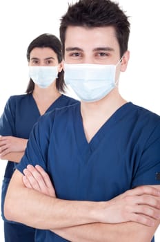 portrait of a team of doctors, man and woman wearing mask and uniform isolated on white background
