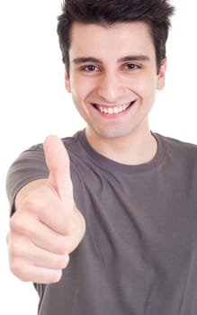smiling young man with thumbs up (focus on hand) on an isolated white background