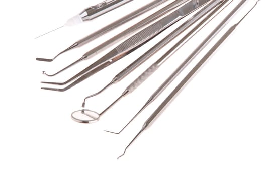 set of stainless steel dental surgery instruments for teeth care (isolated on white background)