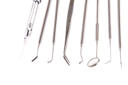 set of stainless steel dental surgery instruments for teeth care (isolated on white background)