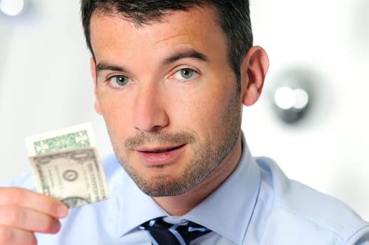 winner and cheerful businessman is showing a dollar