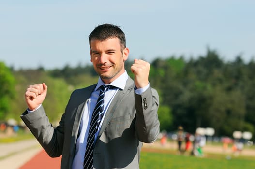 Portrait of a businessman outdoor with winner spirit