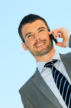 businessman is having a communication with his cellphone