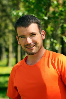 sportive and cheerful man in a natural background