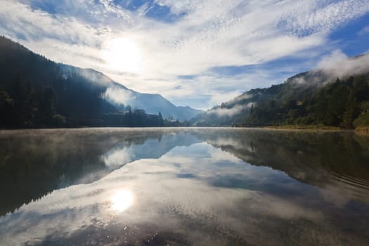 reflections on the lake at a sunrise